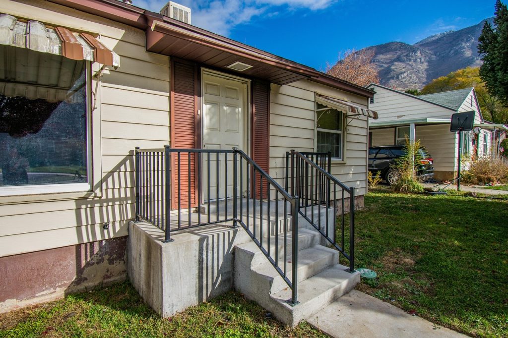 A house with a porch shown in a real estate context.