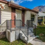 A house with a porch shown in a real estate context.